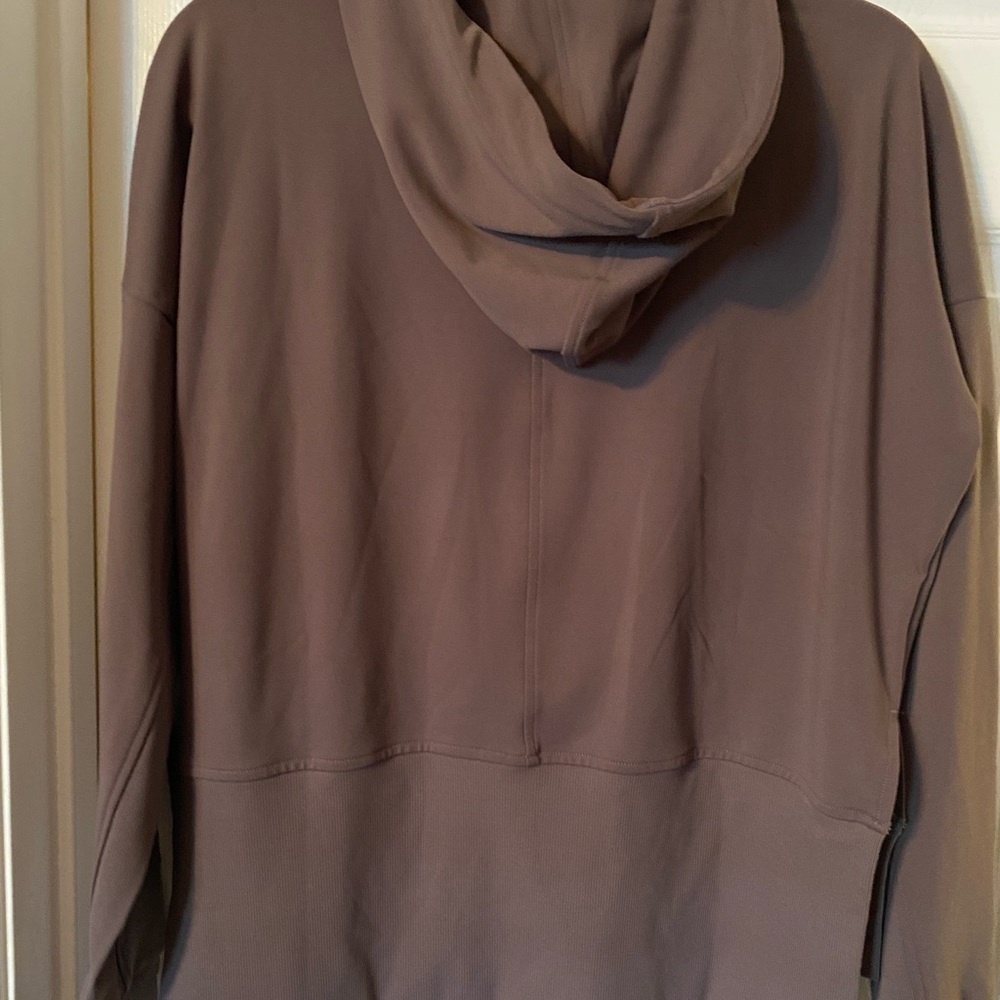 Cute hoodie. 70% nylon 20% spandex. Never worn.